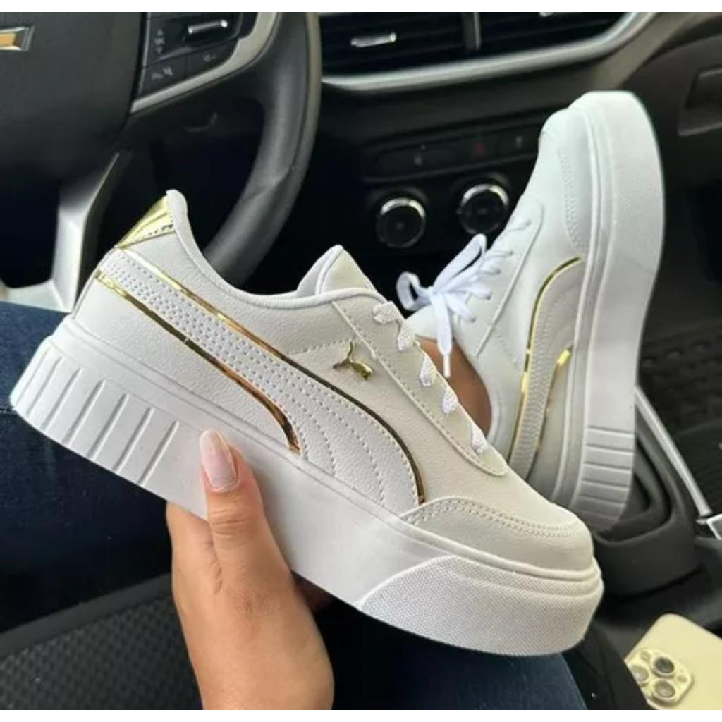 Tenis puma feminino hot sale dourado