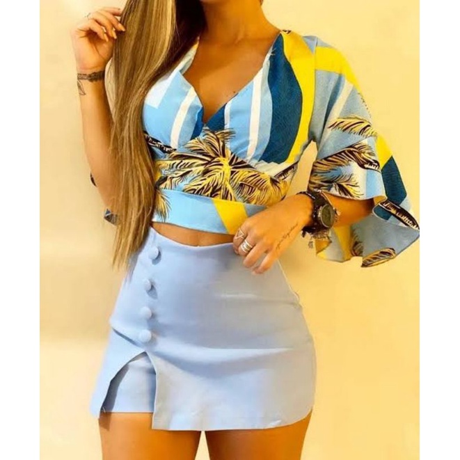 Short saia tend ncia elegante com fenda e bot es encapados lateral